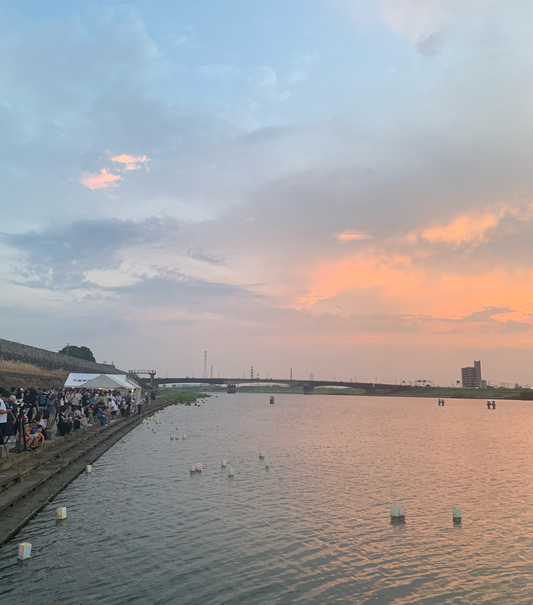 Launching a lantern on the water at the end of the Obon Festival